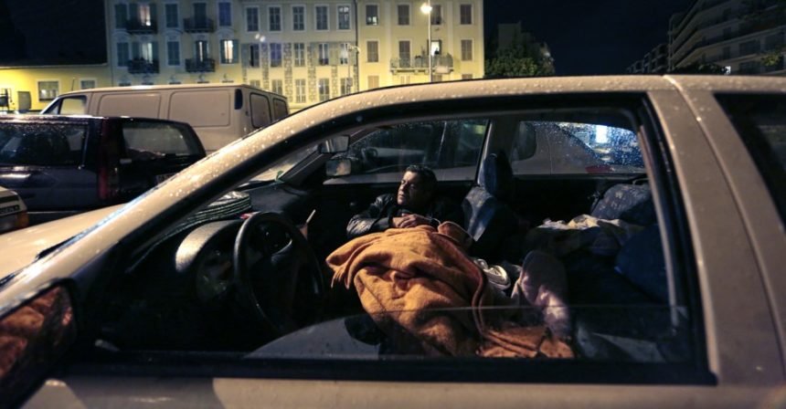 Edy, a man who has been homeless for several years, tries to sleep in his car in Nice