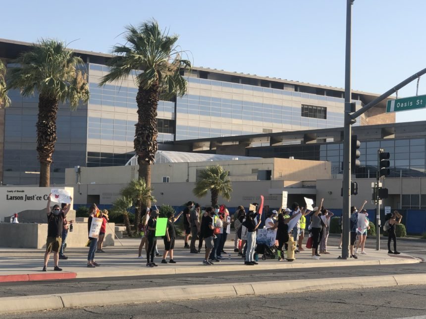 Dozens of protestors gather outside the Larson Justice Center KESQ