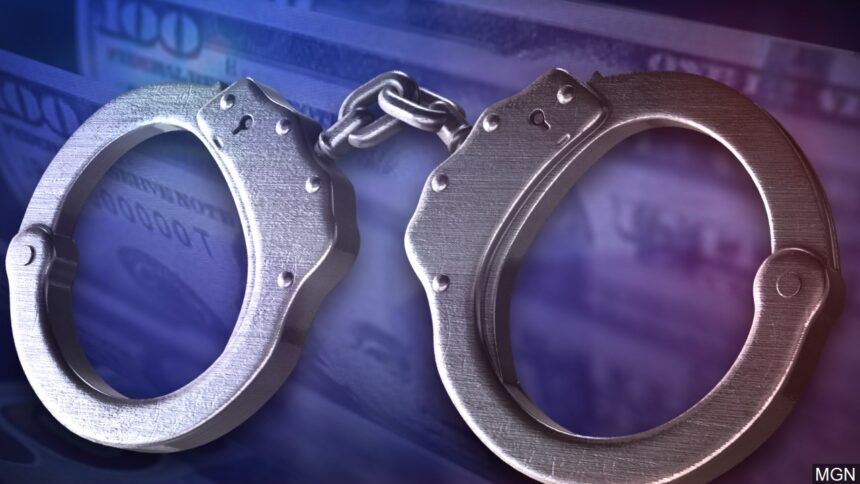 embezzlement arrest and handcuffs