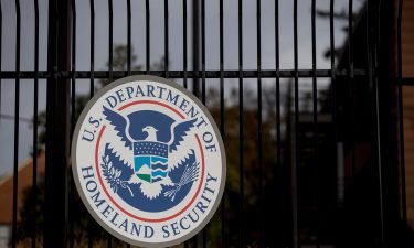 The U.S. Department of Homeland Security (DHS) seal hangs on a fence at the agency's headquarters in Washington