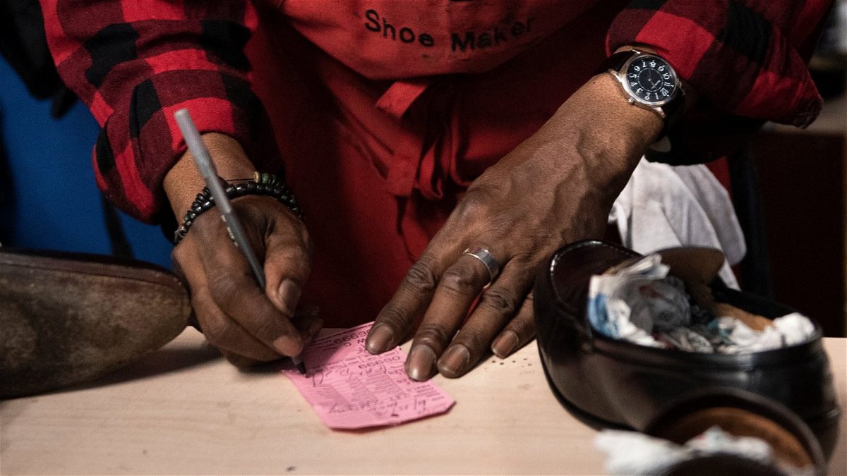 <i>Brendan Smialowski/AFP/Getty Images</i><br/>A shoe cobbler working in a black-owned business in Washington