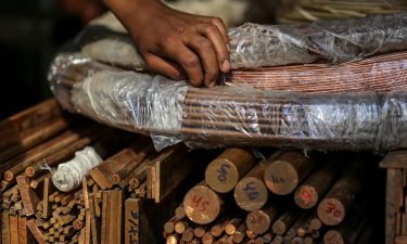 Rods and bars of copper and brass are pictured at a wholesale metal dealer in Mumbai