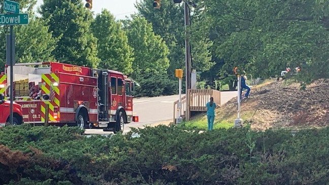 <i>WLOS</i><br/>Emergency crews are on scene near the Planned Parenthood in Asheville after barrels with 'HAZMAT' labels were discovered outside Saturday morning.