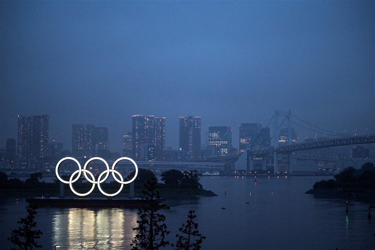 <i>Charly Triballeau/AFP/Getty Images</i><br/>This general view shows the Olympic Rings lit up at dusk on the Odaiba waterfront in Tokyo on July 9