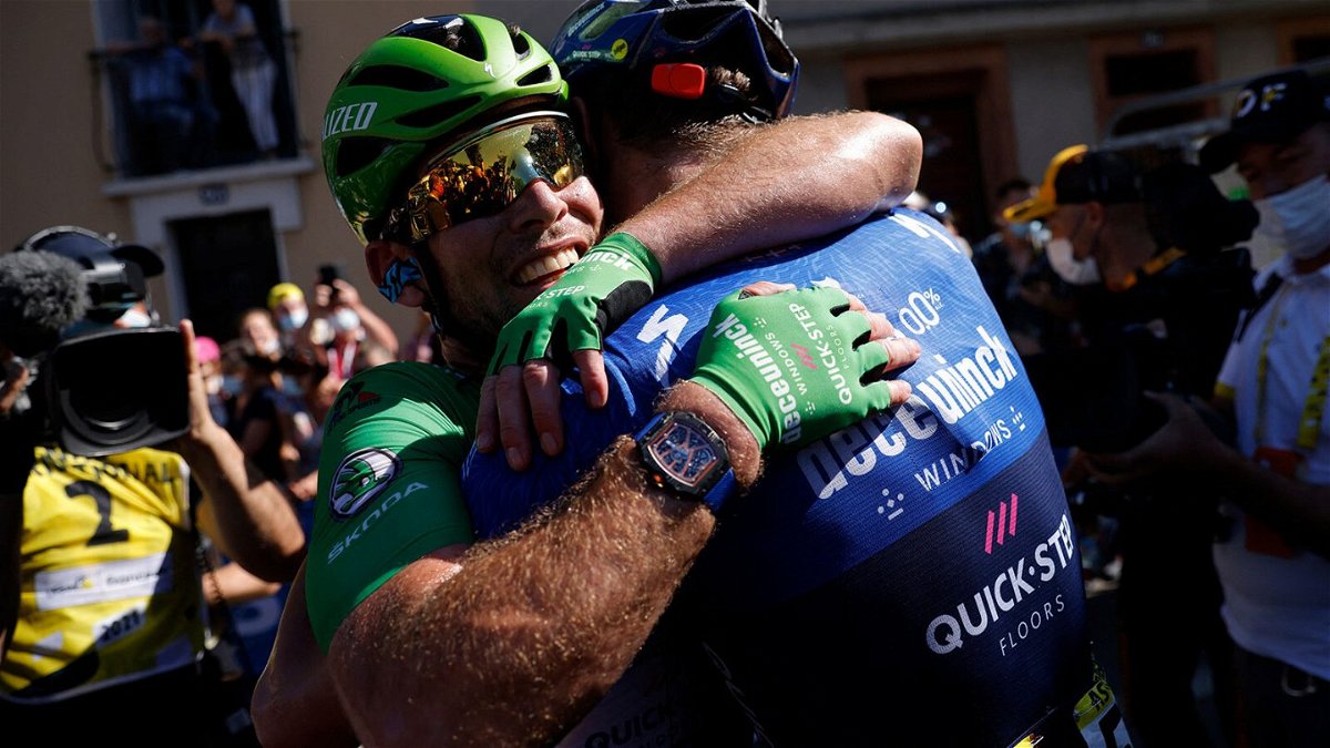 <i>Stephane Mahe/Pool/Getty Images</i><br/>Mark Cavendish celebrates with his team at the end of the 13th stage on July 9.
