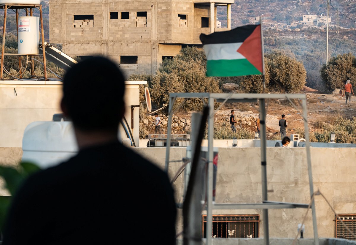 <i>Freddy Wheeler/CNN</i><br/>The Palestinian flag flies above the scene of clashes between Palestinians and Israeli soldiers in Beita.
