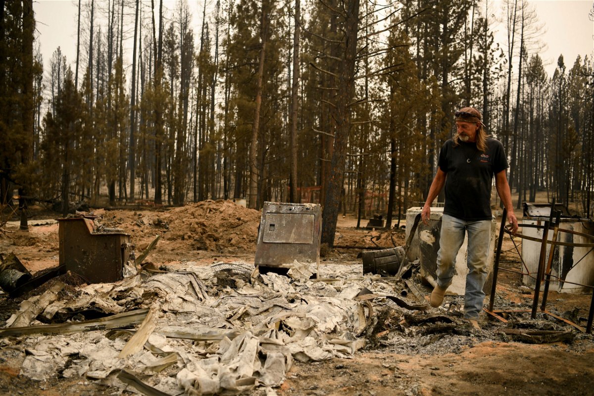 <i>Mathieu Lewis-Rolland/Reuters</i><br/>Scott Griffin surveys his property which was destroyed by the Bootleg Fire