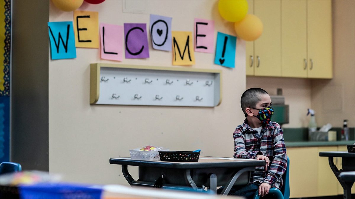 <i>Robert Gauthier/Los Angeles Times/Getty Images</i><br/>Kindergartner Jesse Magana at teacher Alicia Pizzis classroom for the first time in more than a year at Maurice Sendak Elementary. The US CDC updated its Covid-19 schools guidance to emphasize in-person schooling is a priority in the fall