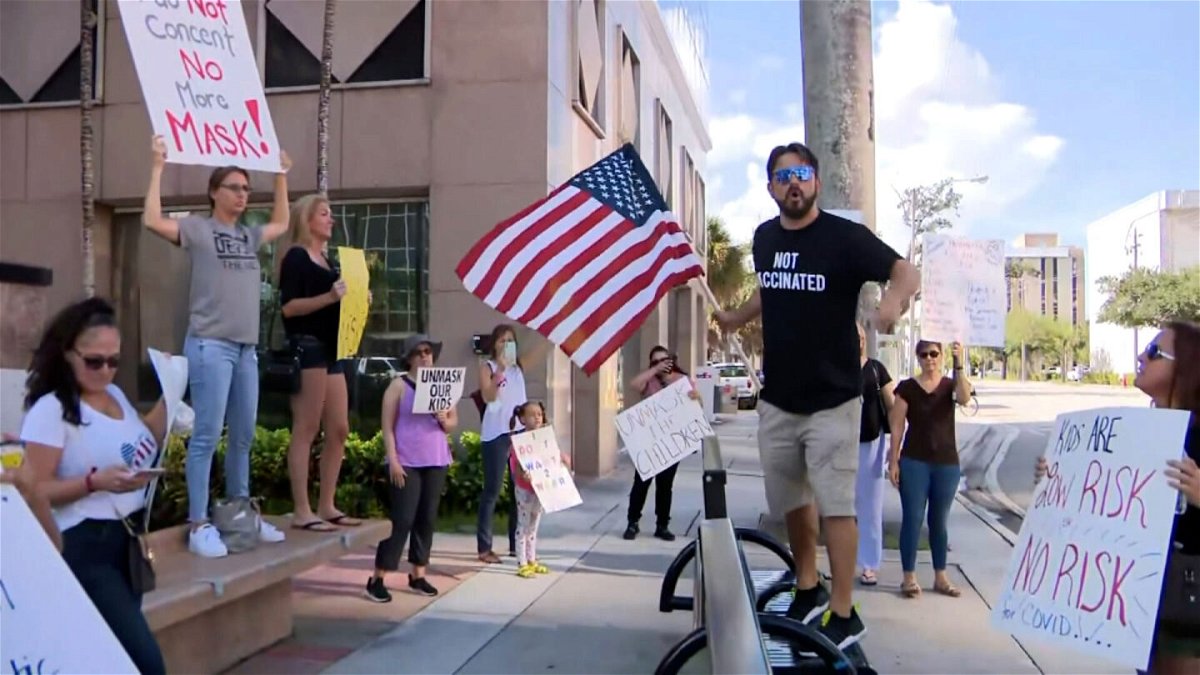 <i>WFOR</i><br/>Anti-mask protesters gathered at the Broward School Board headquarters before a board meeting in Fort Lauderdale