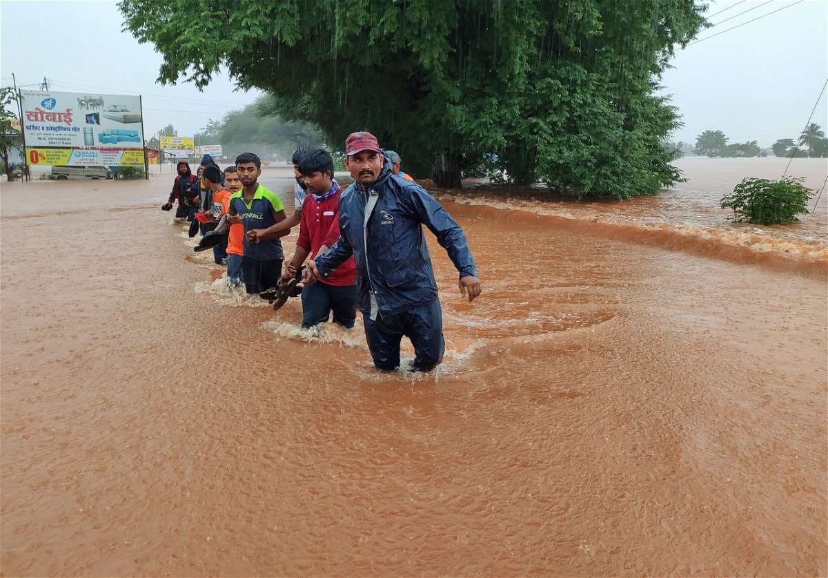 <i>AP</i><br/>National Disaster Response Force personnel rescue people stranded in floodwaters in Kolhapur