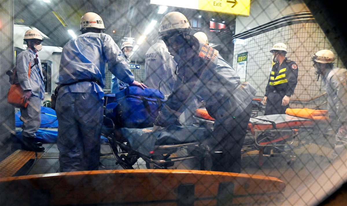<i>AP</i><br/>Emergency workers prepare stretchers at Soshigaya Okura Station in Tokyo after a stabbing on a commuter train on Aug. 6 left at least 10 people injured.