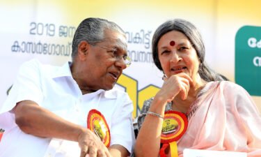 Chief Minister Pinarayi Vijayan with an activist during the "Women's Wall" protests in 2019.