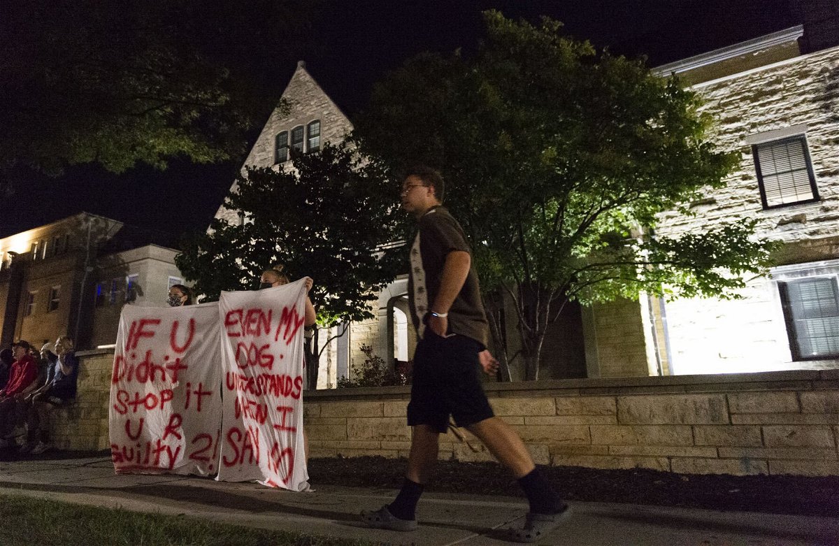 <i>Eakin Howard/Lincoln Journal Star</i><br/>Protesters are seen holding banners outside the Phi Gamma Delta house on Aug. 26. Chancellor Ronnie Green on Sept. 1 told leaders of UNL's student government that he was committed to helping to prevent sexual assault on campus.