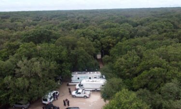 Law enforcement officials conduct a search of the vast Carlton Reserve in the Sarasota