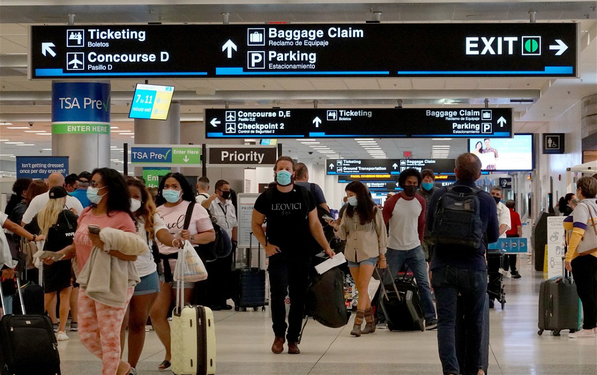 <i>Joe Raedle/Getty Images</i><br/>Travelers make their way through the Miami International Airport on September 3 in Miami