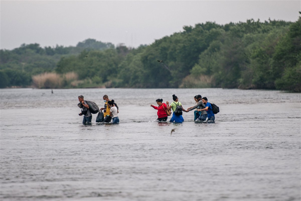 <i>Brandon Bell/Getty Images</i><br/>Migrants cross the Rio Grande into the US at Del Rio