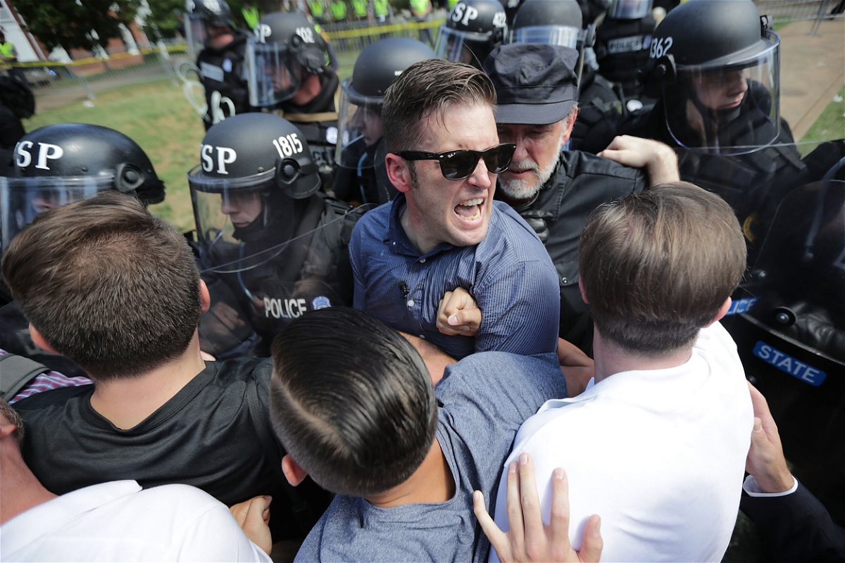 <i>Chip Somodevilla/Getty Images</i><br/>White nationalist Richard Spencer (C) and his supporters clash with Virginia State Police in Emancipation Park after the 