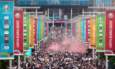 Supporters walk down Olympic Way ahead of the Euro 2020 final between Italy and England at Wembley Stadium on July 11