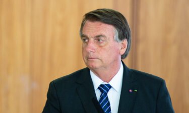 Brazilian senators investigating President Jair Bolsonaro's handling of the pandemic decided late on Tuesday to withdraw recommendations for charges of mass homicide and genocide against him. Bolsonaro is seen here at the Planalto Palace in Brasilia on October 19.