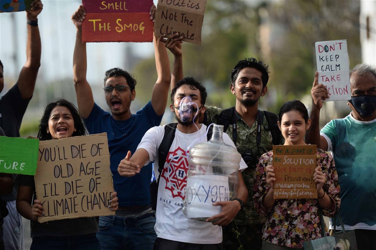 <i>Arun Sankara/AFP via Getty Images</i><br/>Students shout slogans during a demonstration calling for action against climate change