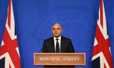 UK Health Secretary Sajid Javid is "leaning towards" requiring staff in the National Health Service (NHS) to be vaccinated against Covid-19. Javid is pictured here at Downing Street on October 20.