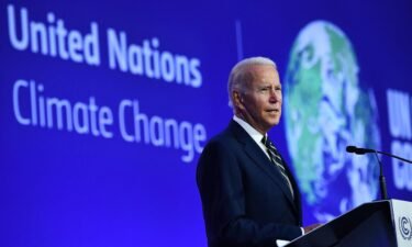 US President Joe Biden delivers a speech on stage during a meeting at the COP26 UN Climate Change Conference in Glasgow