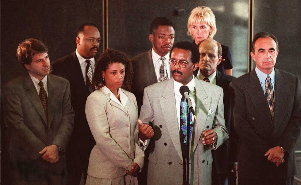 <i>David Sprague/AFP/Getty Images</i><br/>O.J. Simpson defense lawyers hold a press conference following court session in Los Angeles. (L-R) Barry Scheck