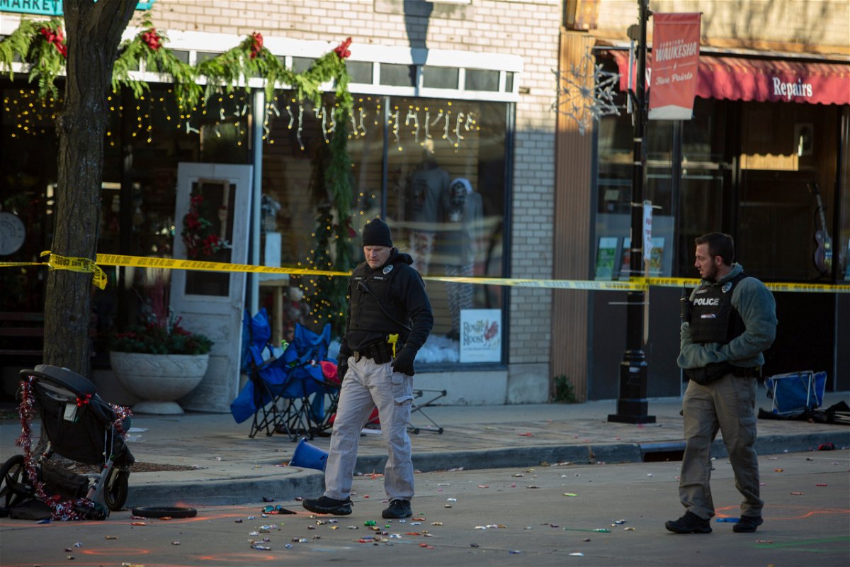 <i>Jim Vondruska/Getty Images</i><br/>More than a dozen remain hospitalized after deadly Waukesha parade crash. Police are seen at the Christmas parade site on November 22