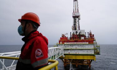 The White House has accused OPEC and its allies of putting the global economic recovery at risk by refusing to pump more oil. An employee is shown here at an oil platform operated by Lukoil company in the Baltic Sea