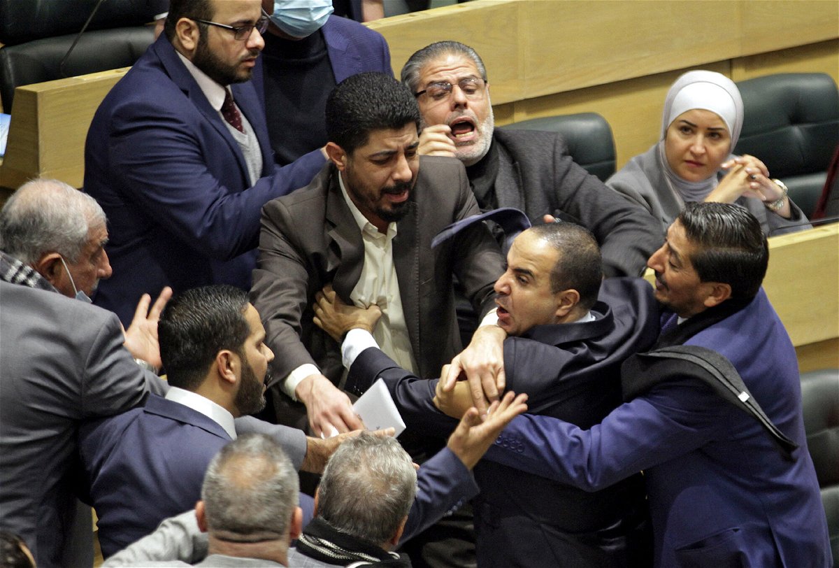 <i>AFP/Getty Images</i><br/>Jordanian parliament members are separated during an altercation in the parliament in the capital Amman on December 28.