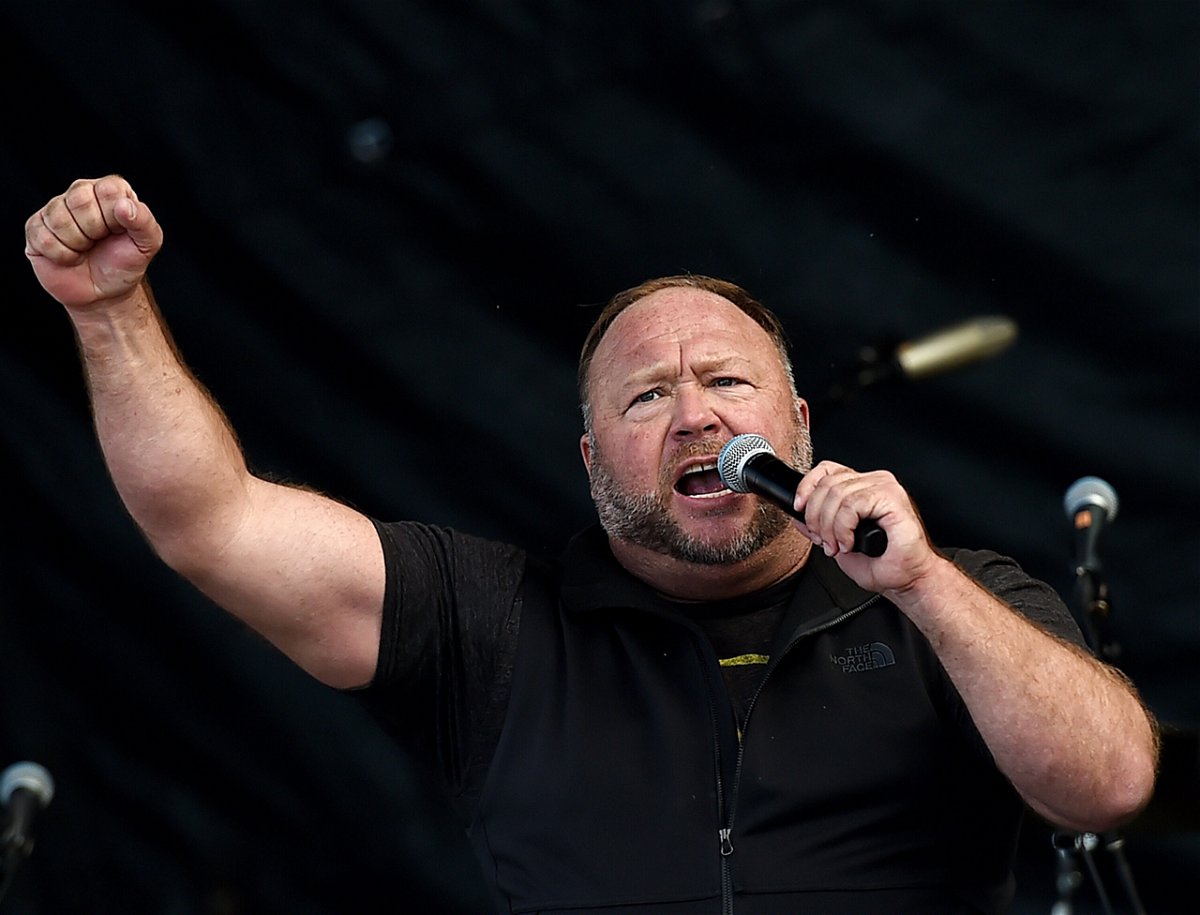 <i>Olivier Douliery/AFP/Getty Images</i><br/>Far-right radio show Alex Jones speaks to supporters of President Donald Trump as they demonstrate in Washington