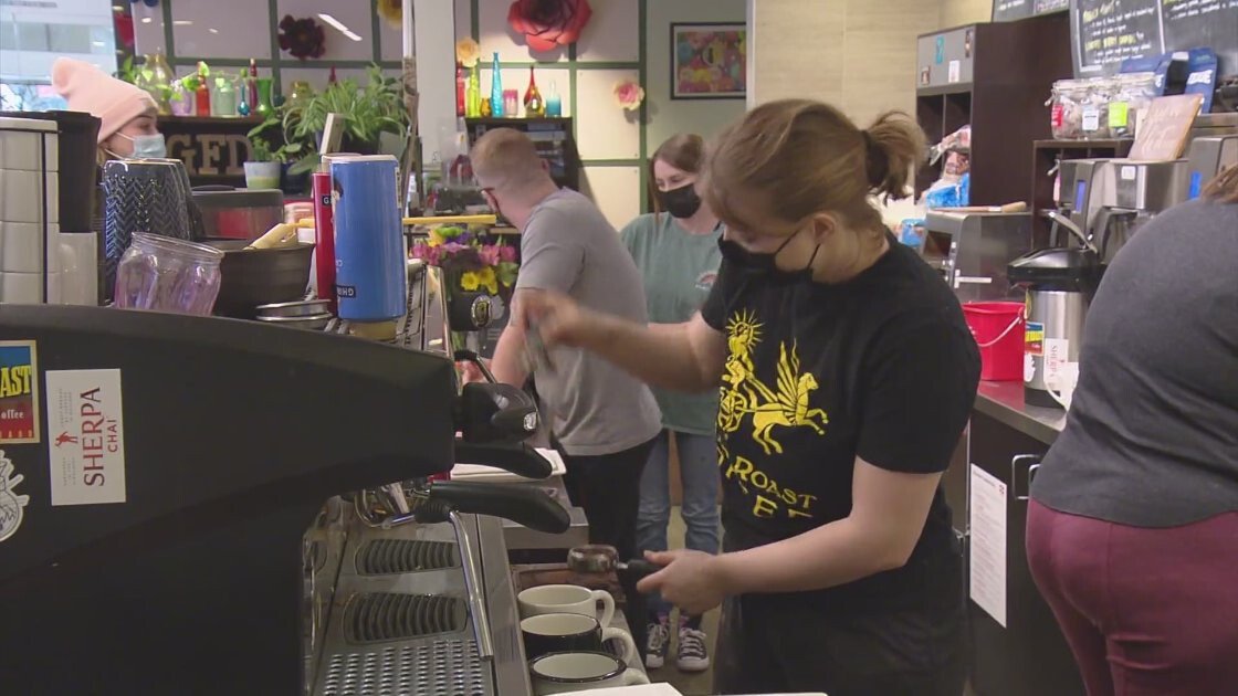 <i>KCNC</i><br/>Workers make coffee at the Grounds for Dismissal coffee shop in Denver