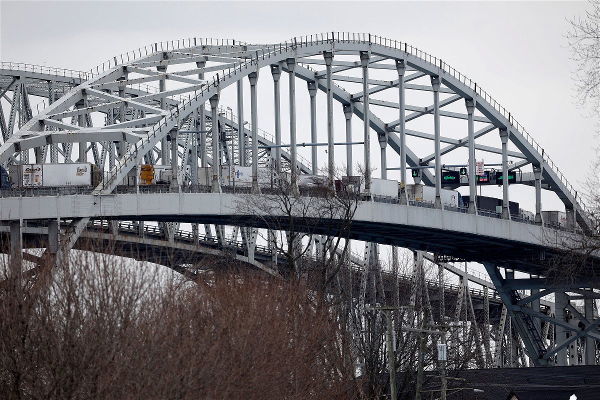 <i>Jeff Kowalsky/AFP/Getty Images</i><br/>Trucks lined up at the Blue Water Bridge that connects Port Huron