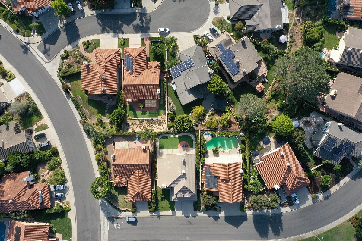 <i>Bing Guan/Bloomberg/Getty Images</i><br/>Single-family homes are seen in this aerial photograph taken over San Diego