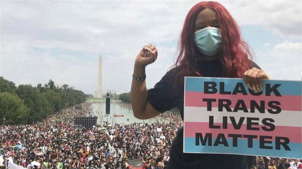 <i>Courtesy Nupol Kiazolu</i><br/>Nupol Kiazolu holds a  Black Trans Lives Matter sign on August 28