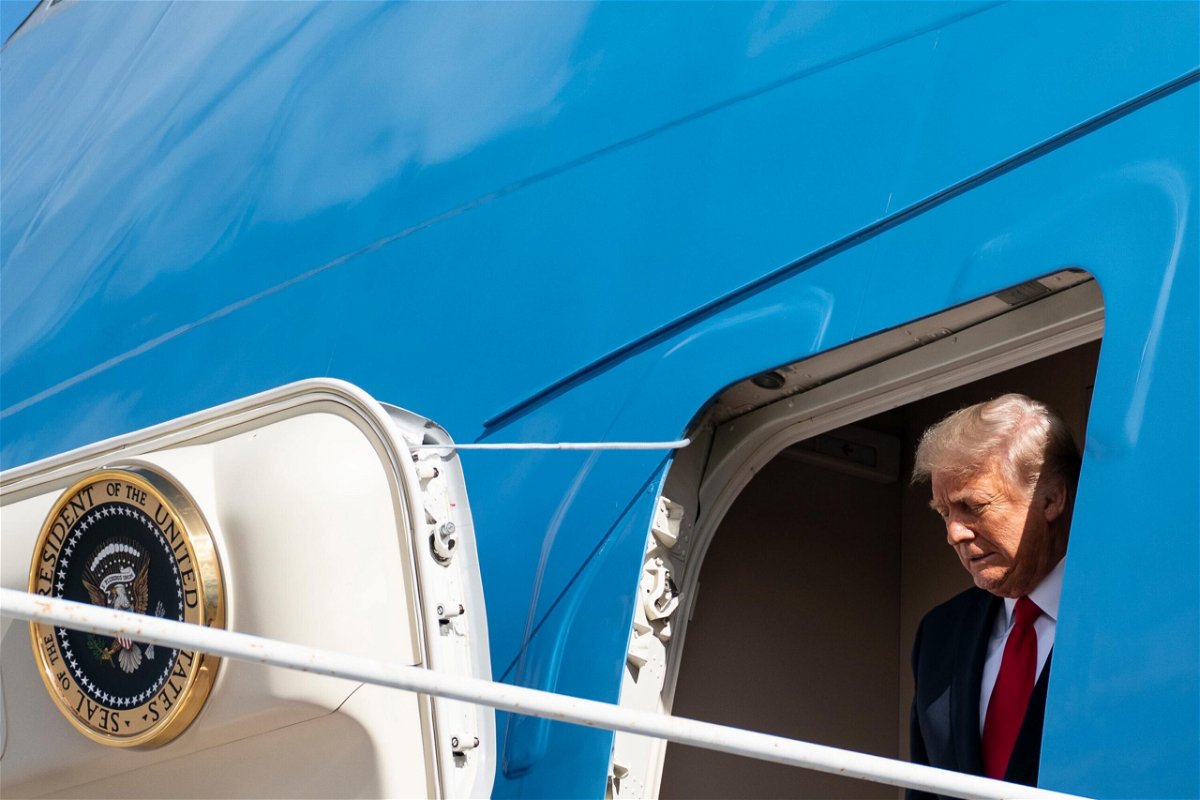 <i>ALEX EDELMAN/AFP/Getty Images</i><br/>Outgoing President Donald Trump steps off Air Force One as he arrives at Palm Beach International Airport in West Palm Beach