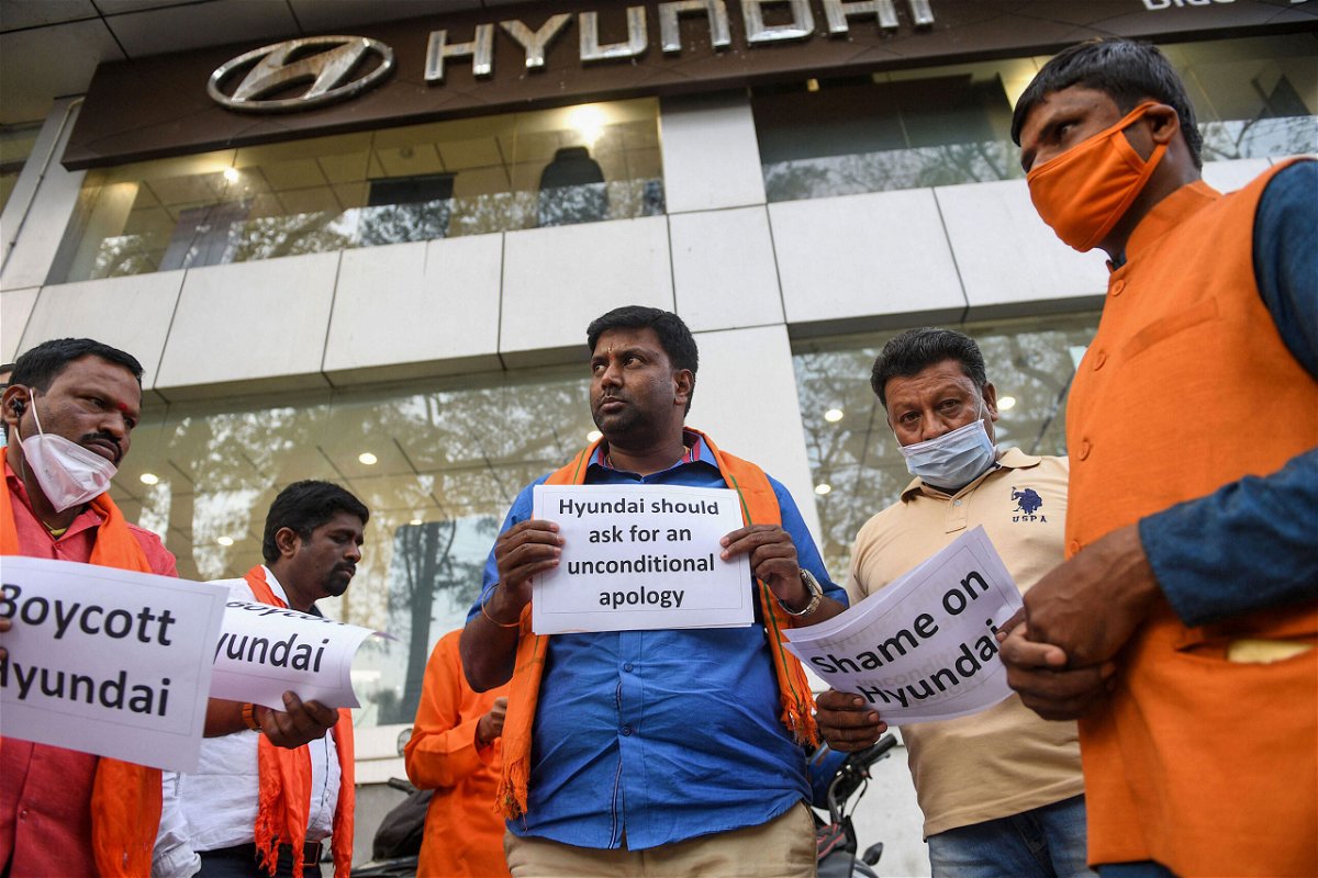 <i>Manjunath Kiran/AFP/Getty Images</i><br/>Protestors belonging to Hindu Janajagruti Samiti hold placards during a demonstration staged in front of South Korean automobile manufacturer