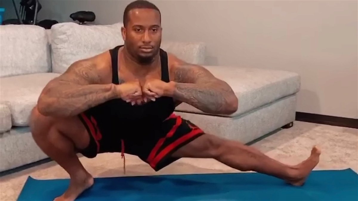 <i>Courtesy Michael Daniels</i><br/>Mike Daniels performs deep lateral lunges