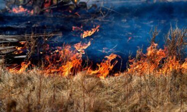 Fire burns into dry grass near West Highway 80 in Abilene