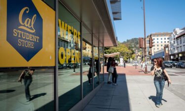 A person walks past the student store on the University of California