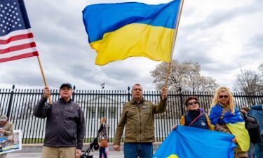 Members of United Help Ukraine and other activists hold a rally outside the White House on March 20