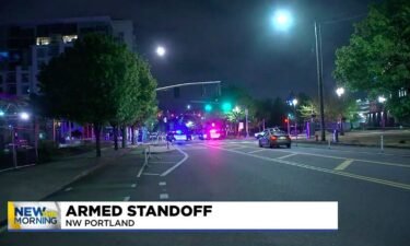 A man is in custody after he barricaded himself inside an occupied apartment in northwest Portland Monday night.