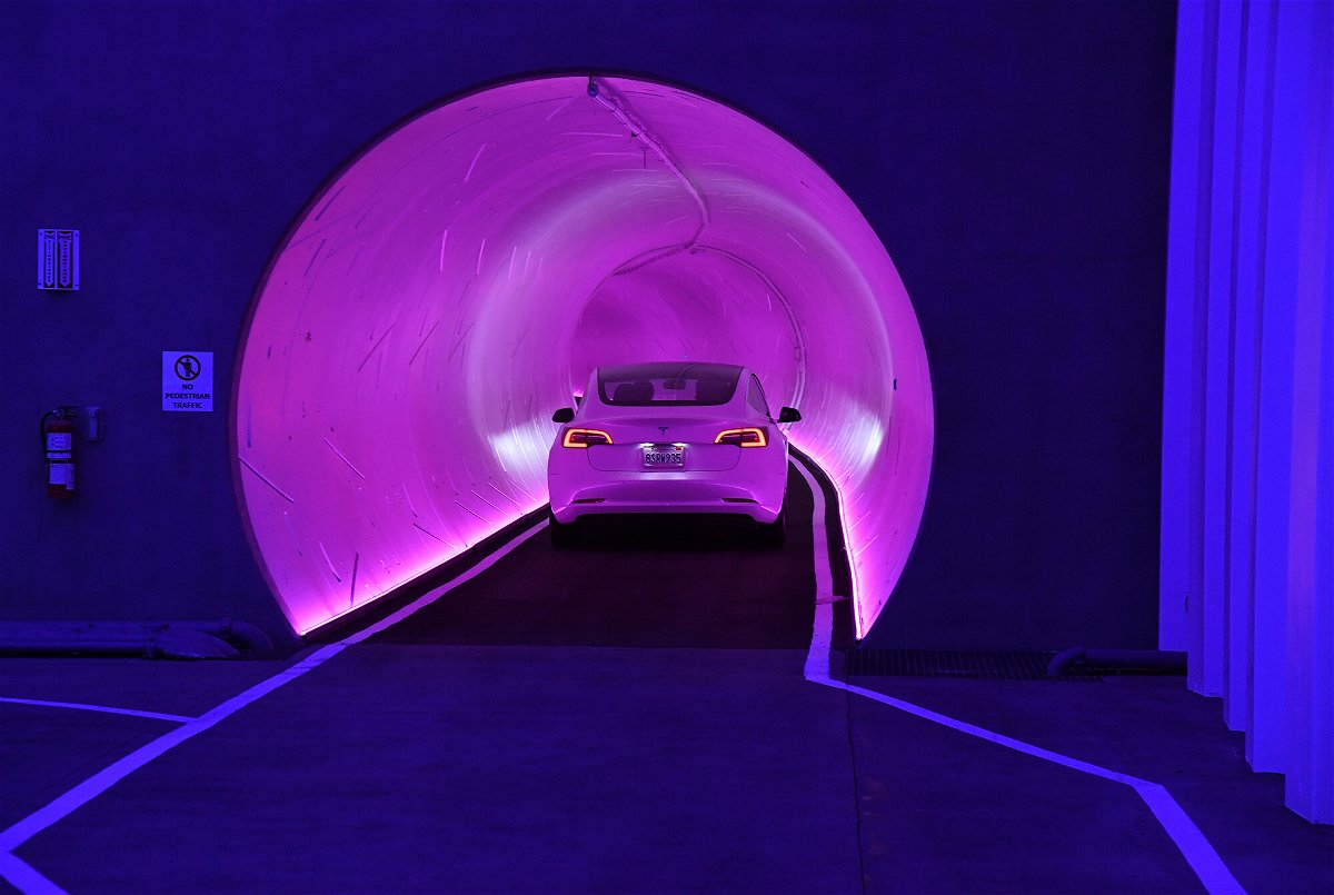 <i>Ethan Miller/Getty Images</i><br/>A Tesla car drives through a tunnel in the Central Station during a media preview of the Las Vegas Convention Center Loop on April 9