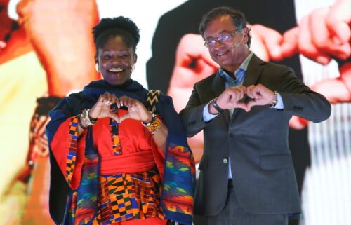Colombian presidential candidate Gustavo Petro and his vice-presidential candidate Francia Marquez gesture during a presentation event in Bogota