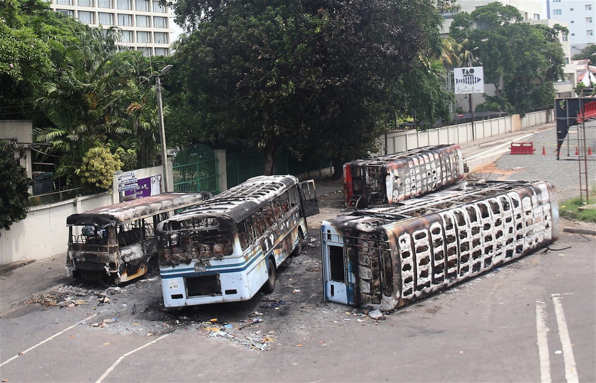 <i>Pradeep Dambarage/NurPhoto/Getty Images</i><br/>Burned buses near the official residence of Sri Lanka's outgoing prime minister Mahinda Rajapaksa in Colombo