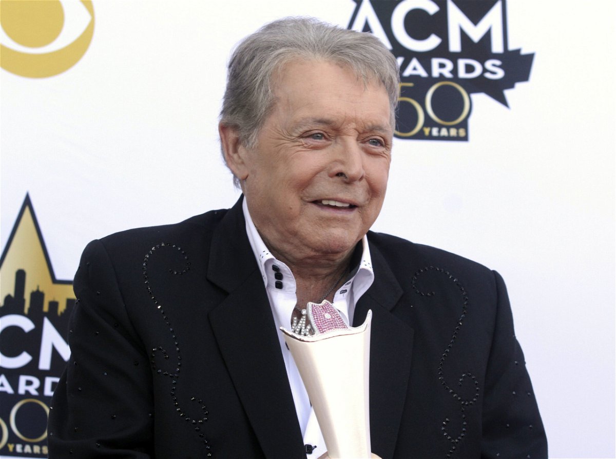 <i>Jack Plunkett/Invision/AP</i><br/>Mickey Gilley poses with the Triple Crown Award on the red carpet at the 50th annual Academy of Country Music Awards at AT&T Stadium in Arlington