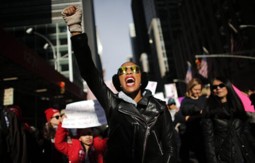 A woman shouts as she attends the Women's March in New York City in 2018.