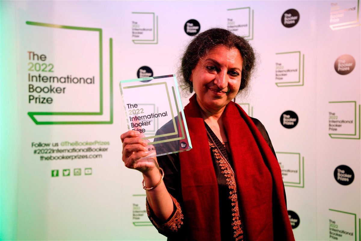 <i>David Cliff/AP</i><br/>Author Geetanjali Shree poses with the 2022 International Booker Prize award for her novel 'Tomb of Sand' in London on May 26.