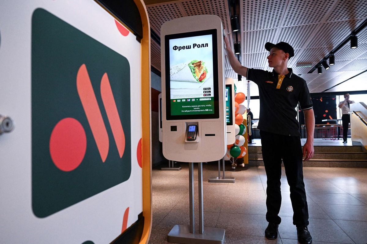 <i>Kirill Kudryavtsev/AFP/Getty Images</i><br/>An employee cleans a self-ordering machine at the Russian version of a former McDonald's restaurant before the opening ceremony