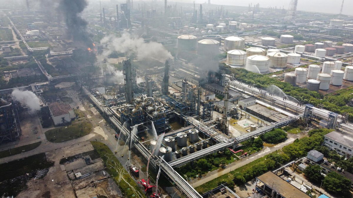 <i>Stringer/Reuters</i><br/>Fire engines and rescue workers at the scene of the fire in Shanghai on Saturday.